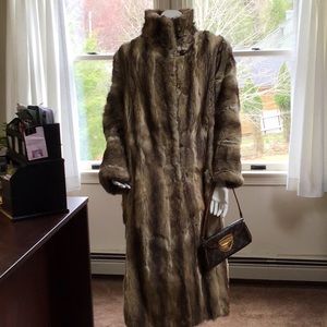 Women’s below the knee length Raccoon fur coat